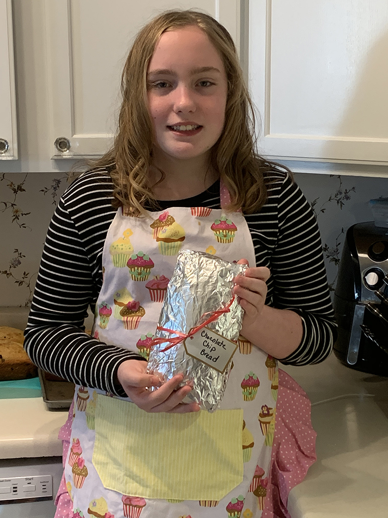 Beth Bogg's niece Taylor Lunn baking 25 loaves of bread