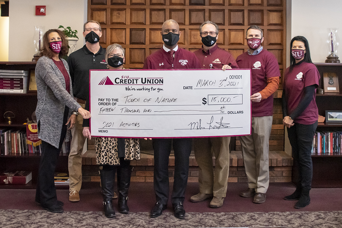 SIU Credit Union present check to Touch of Nature