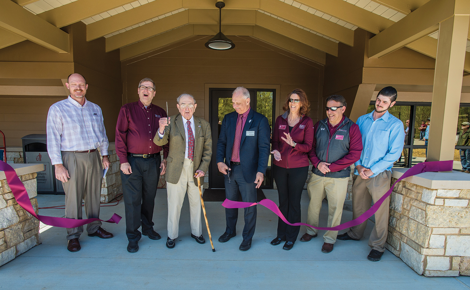 Ralph E. Becker, third from left, joins university officials to open the renovated Ralph E. Becker Boathouse Pavilion.